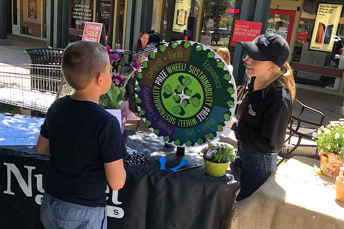 Food 4 Less Woodland Sustainability coordinator with guest on Earth Day